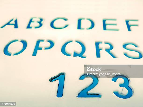 Letters Numbers Carved In A Plastic Plate Stock Photo - Download Image Now - 2015, Abstract, Aiming