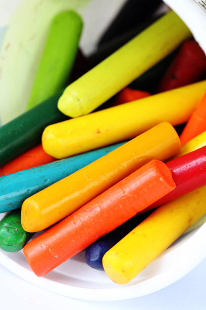 Closeup of colorful crayon pieces, art or school supplies