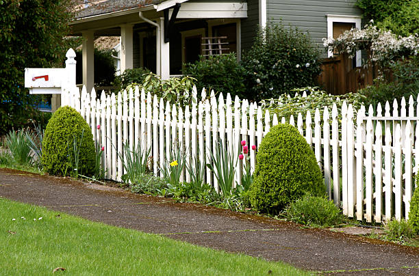 istock Mailbox And White Picket Fence In An Americana Scene 476049217