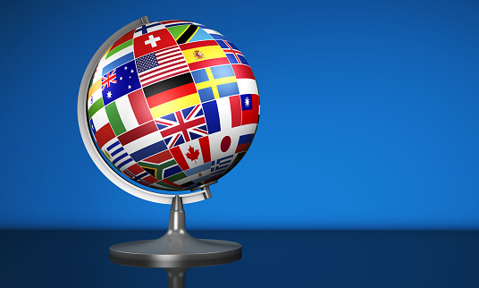 World globe in front of British flag.