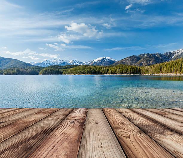 istock Wooden planks background with lake, Germany 476051042