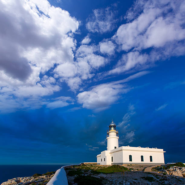 istock Menorca sunset at Faro de Caballeria Lighthouse 476051266