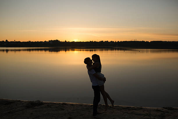 istock Couple in sunrise on the beach 476053688
