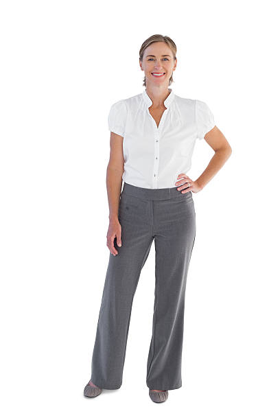 istock Smiling businesswoman standing with hands on her hip 476062011