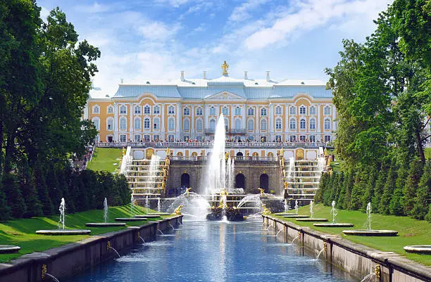 Saint Petersburg, Russia - July 9, 2013: Tourists walk near Petrodvoretz (Peter I Palace) and Grand Cascade Fountain in the Saint Petersburg.