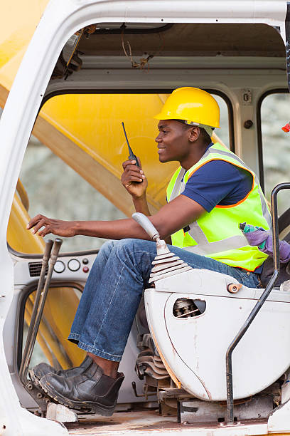 istock afro american man operates excavator 476063469