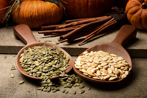 istock Raw and roasted pumpkin seeds 476063525