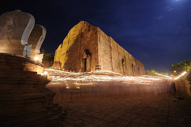 istock Walk with lighted candles in hand around a temple. 476064019