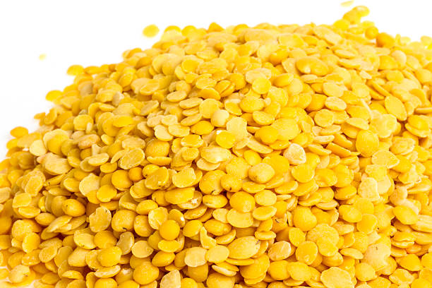 istock Yellow lentils isolated on white background. Macro shot 476072625