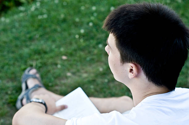 Reading man in outdoor stock photo