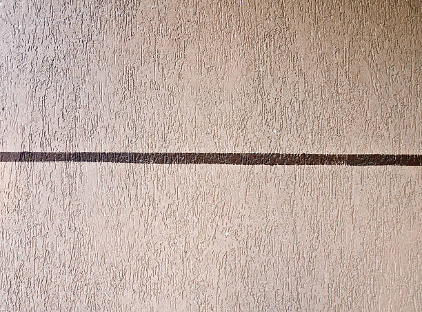 Beige wall with brown line stock photo