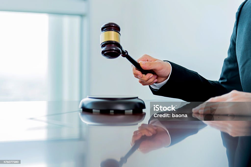 Female judge Female judge with wooden gavel. Courtroom Stock Photo