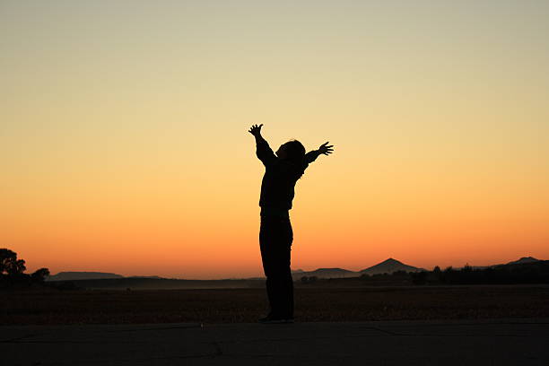 istock Woman at Sunset 476077935