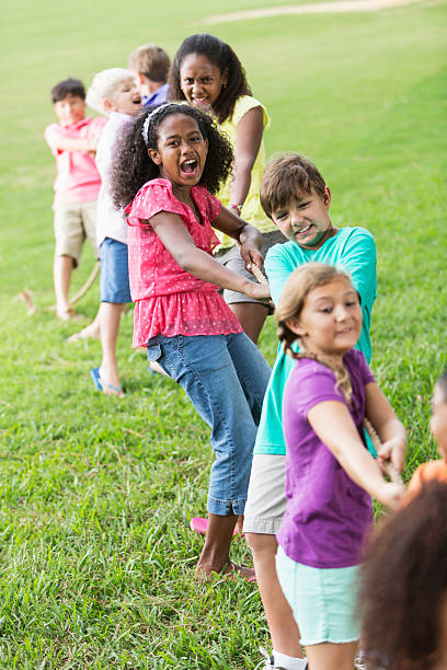 istock Children playing tug of war 476077991