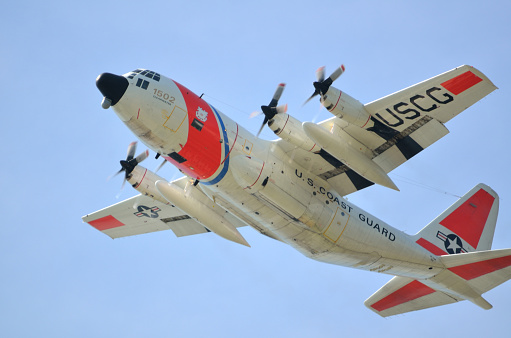 St. Augustine, Florida, USA - May 12, 2015: U.S. Coast Guard C-130 Hercules rescue aircraft taking off from St. Augustine airport to patrol and guard the coastline of Florida.