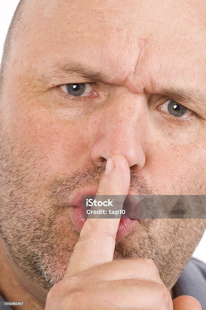 Be Quiet Close up of a man signalling to be quiet. Adult Stock Photo