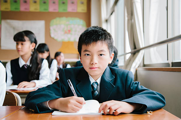 istock High school student, young male student working in classroom, Japan 476081360
