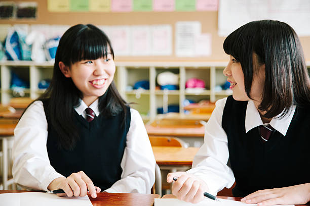 istock High school students, two teenagers sit together, classroom, Japan 476081382