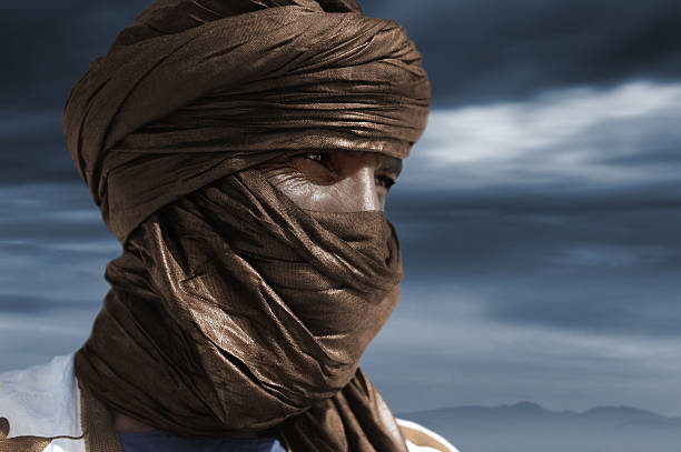 Tuareg with camel on the western part of The Sahara Desert in Morocco. The Sahara Desert is the world's largest hot desert.