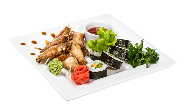 istock Buffalo chicken wings on plate with sushi 476083605