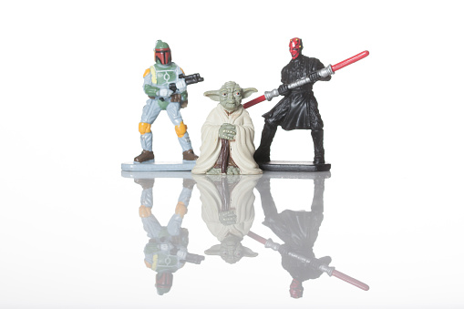 Cantonment, Fl, USA-June 1, 2015:  Miniature figures on white background, shot in studio, characters of Star Wars film franchise created by George Lucas.