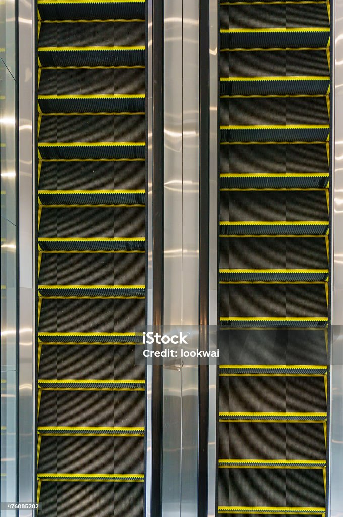Looking down at multiple escalators Looking down at multiple escalators in an office building 2015 Stock Photo