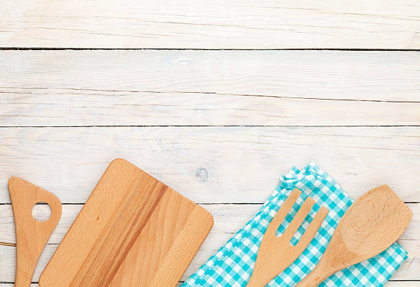 istock Kitchen utensils over white wooden table background 476086004