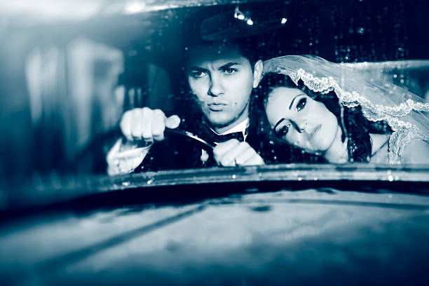 istock grooms inside car in rainy day 476086102