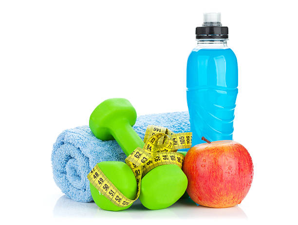 istock Two green dumbells, tape measure and drink bottle 476088592