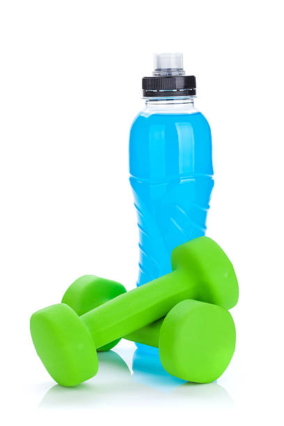 istock Two green dumbells and water bottle 476088596