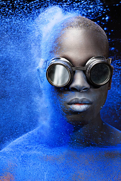 istock black male model covered by blue powder splash 476089210