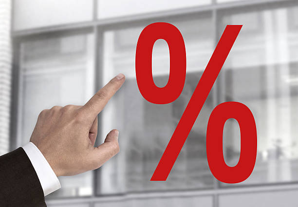 Hand pointing on percentage sign concept