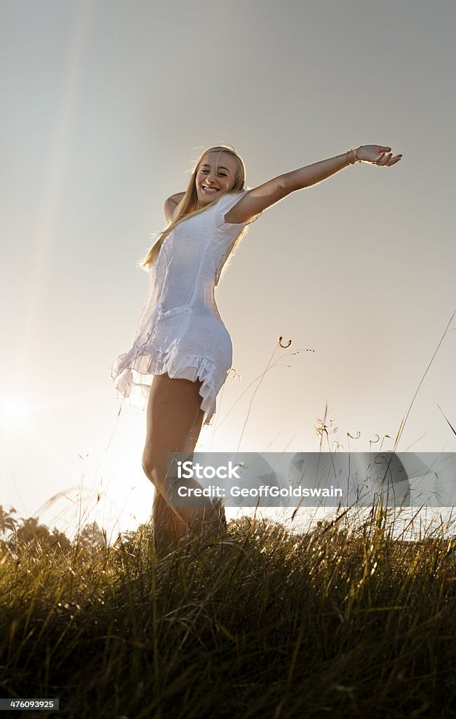 young healthy girl joy sun jumping field 20-29 Years Stock Photo