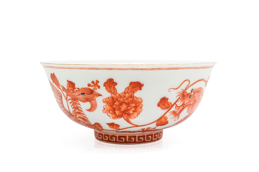 Chinese antique bowl with dragon and cygnet painting, isolated on white background