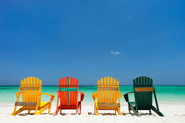 istock Colorful chairs on Caribbean beach 476094582