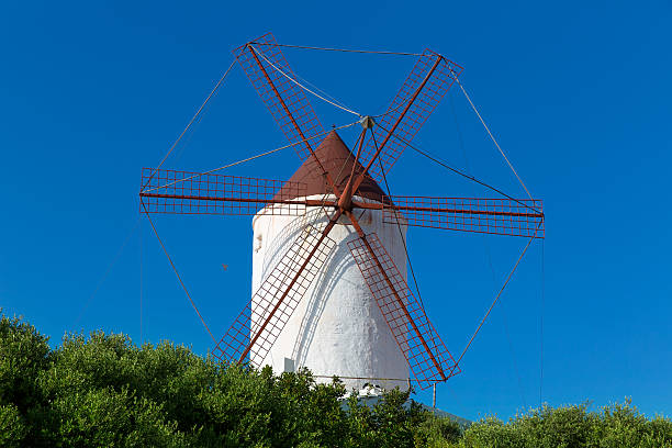 Menorca Es Mercadal windmill on blue sky at Balearics Menorca Es Mercadal windmill on blue sky at Balearic Islands balearics stock pictures, royalty-free photos & images