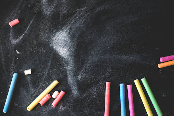 istock Black old empty chalkboard for copy space with colorful pieces 476097342