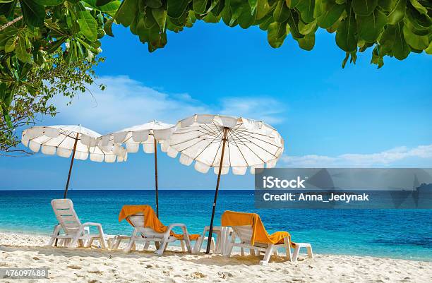 Sunbeds And Orange Towels Under Umbrellas Thailand Stock Photo - Download Image Now - 2015, Asia, Bangkok