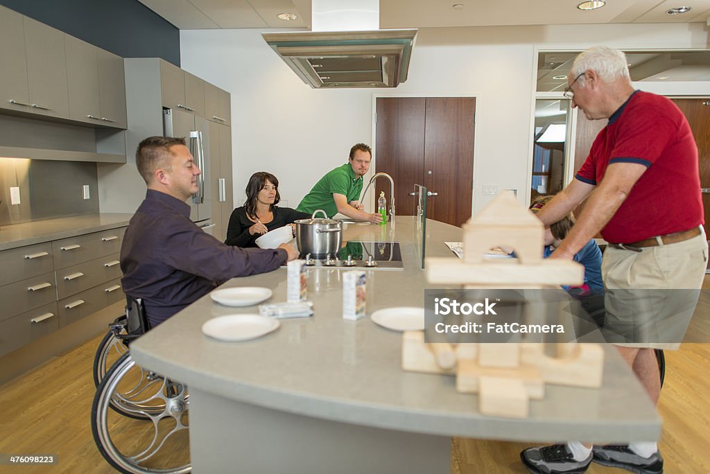 Cooking Disabled couple cooking in an accessible kitchen. Cooking Stock Photo