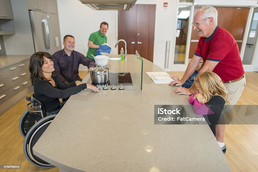 Cooking Disabled couple cooking in an accessible kitchen. Kitchen Stock Photo