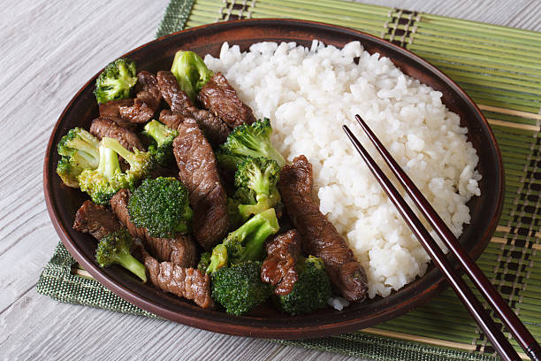 istock Asian beef with broccoli and rice close-up. Horizontal 476098470