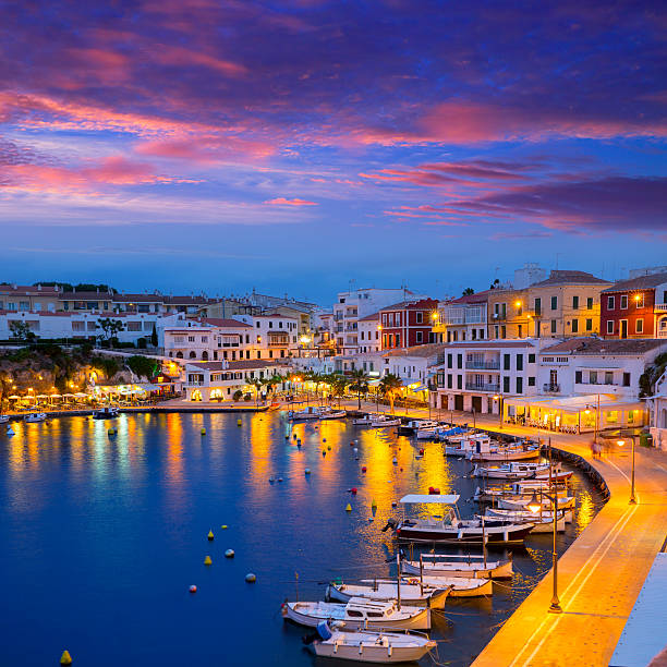 Calasfonts Cales Fonts Port sunset in Mahon at Balearics Calasfonts Cales Fonts Port sunset in Mahon at Balearic islands balearics stock pictures, royalty-free photos & images