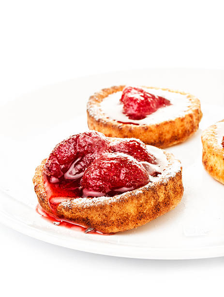 istock Dessert fruit cake with strawberry on a white plate isolated 476102711