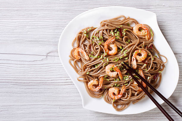 istock Soba with shrimp and chopsticks horizontal view from above 476102804