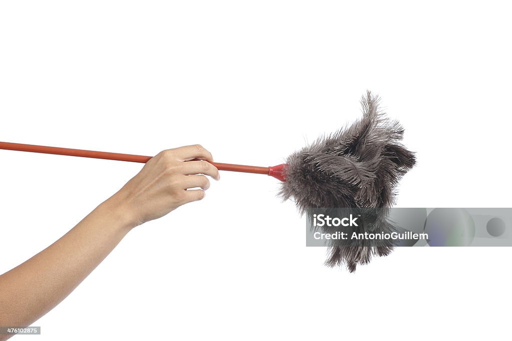 Woman hand holding a duster clean Woman hand holding a duster clean isolated on a white background Duster Stock Photo