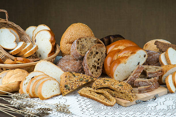 istock Assortment of sliced bread on a tablecloth 476104288