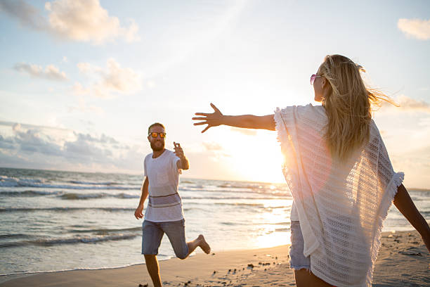 istock Love and passion-Young couple on beach at sunset 476106896