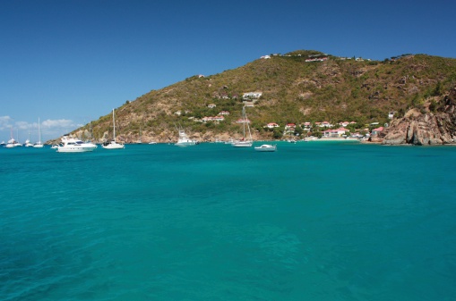 Clear torquoise water, tropical caribbean island, yachts and boats