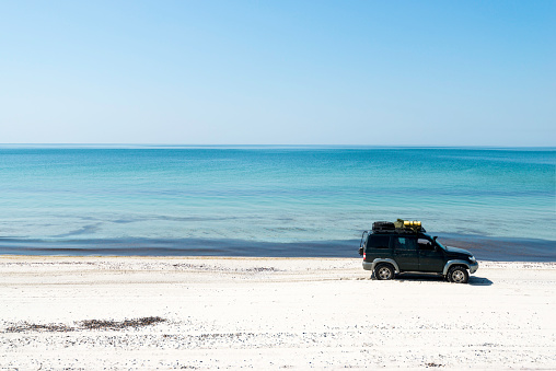 travel on off-road car on a sandy coast. Auto adventure