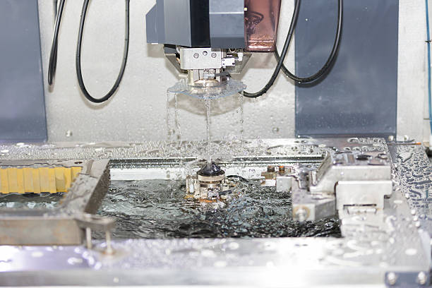 istock CNC wire cut machine cutting mold parts 476107466